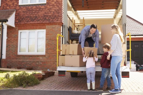 Removal team sorting recyclable moving materials in London