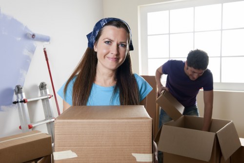 Removal team handling household items during a move