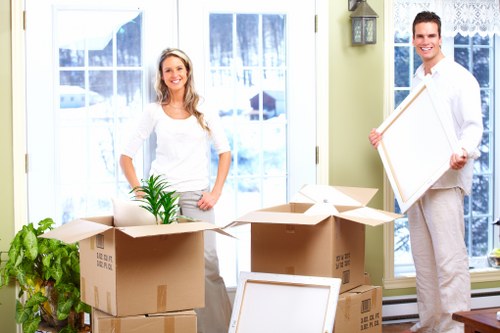 Professional movers handling furniture during a London move