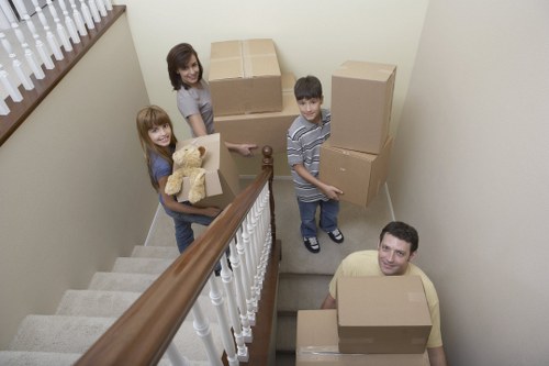 Removal team carrying furniture during a London relocation